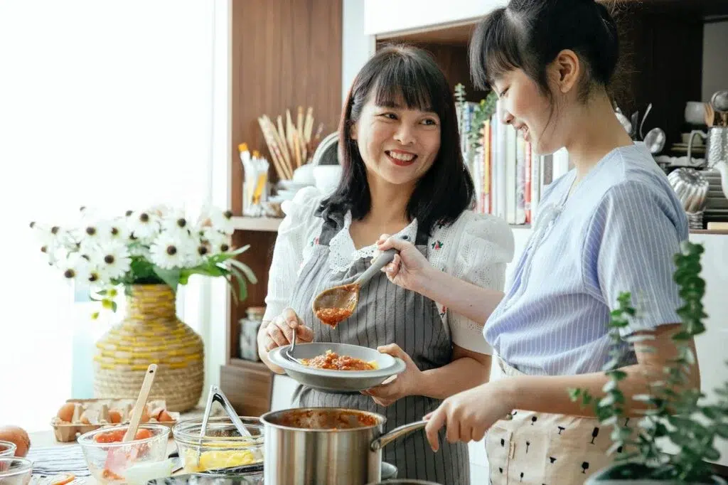  Mom and Daughter cooking together - Cooking Techniques