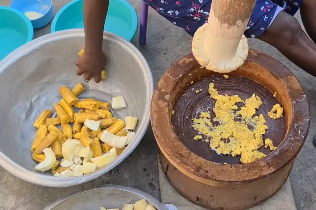 the ingredients are pounded together in a large mortar 