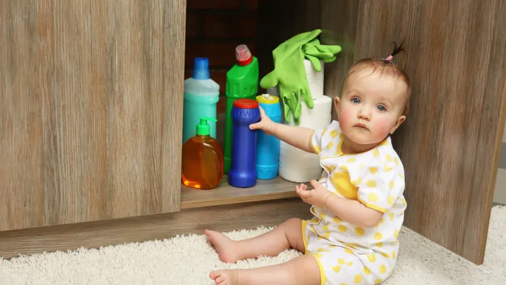 Kitchen Safety - Little Girl Playing with Detergents in Kitchen