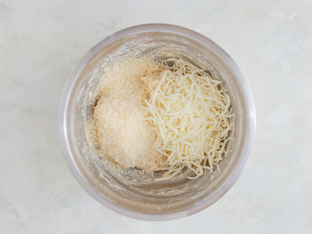  Prepare the Cobbler Dough 🍞Cheesy Potato Cobbler – The Ultimate Comfort Food! -A golden-brown cheesy potato cobbler in a baking dish, with gooey melted cheese on top.