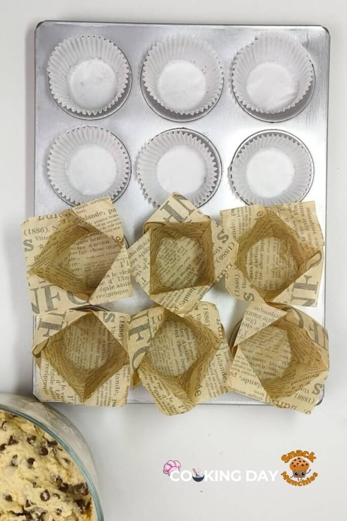 A muffin tine with muffin liners for Chocolate Chip Muffins Recipe