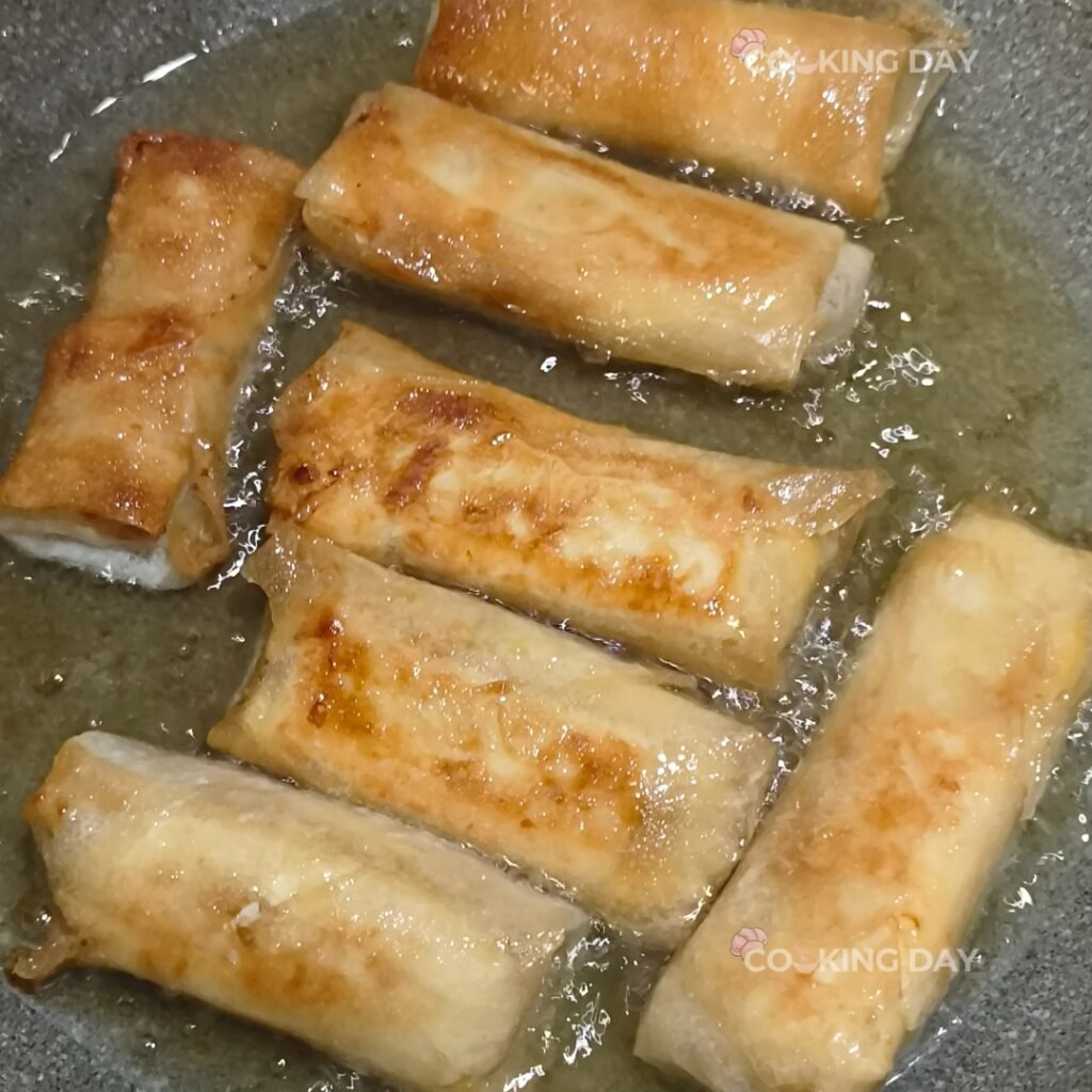 Fry Until Crispy and Golden -Cheese Turon (Cheese Banana Lumpia) – A Sweet & Savory Filipino Delight! 🧀🍌🔥