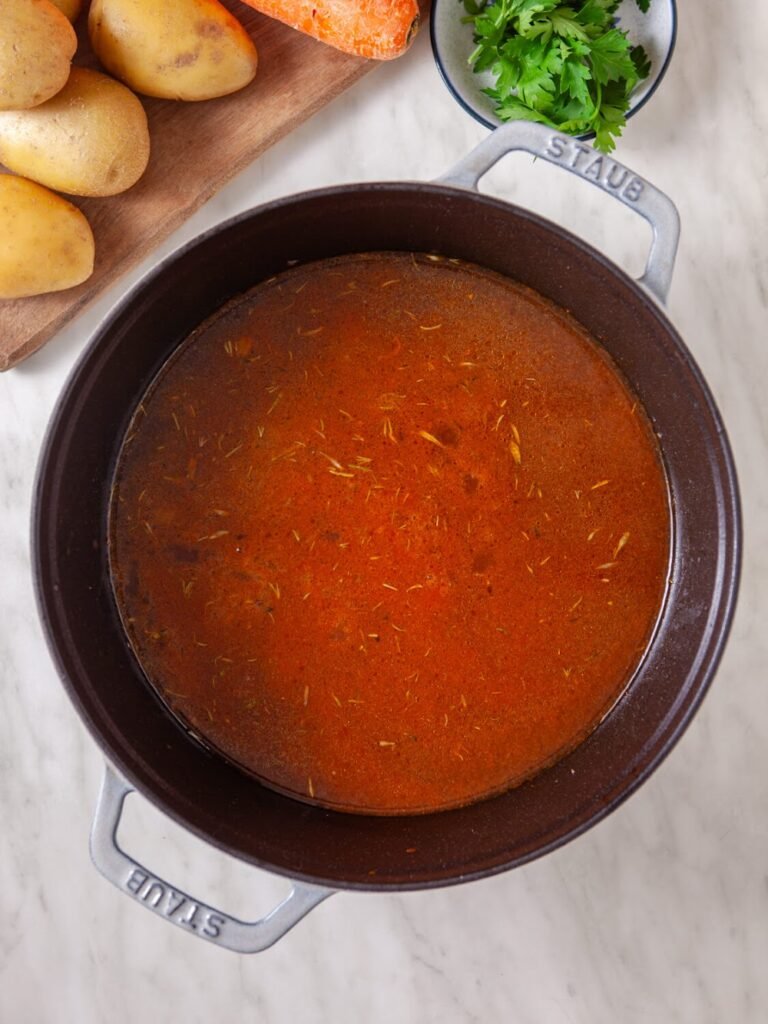 Step 4: Add the Lager and Broth - Easy Lager Beef Stew Recipe