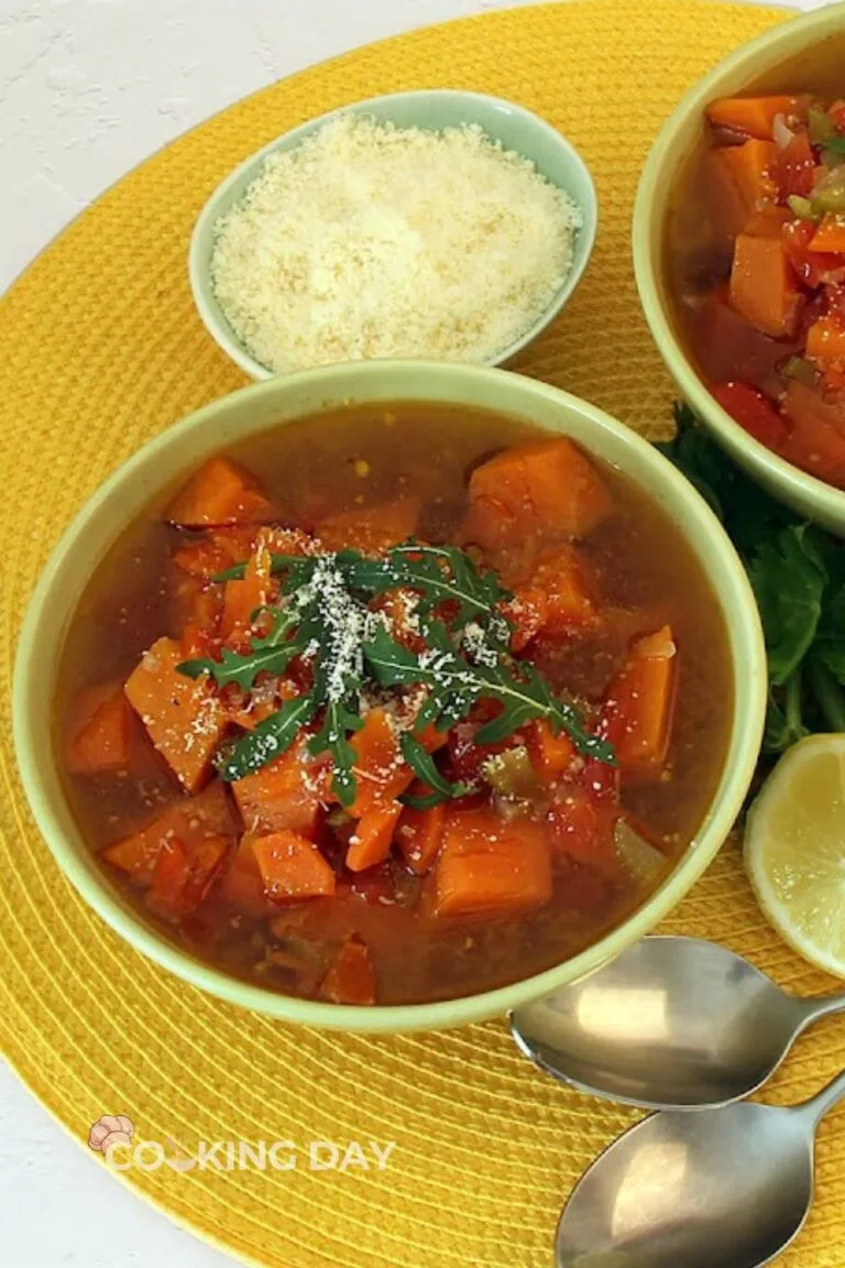 Sweet potato vegetable soup with carrots, celery, tomatoes, spinach, and Parmesan cheese