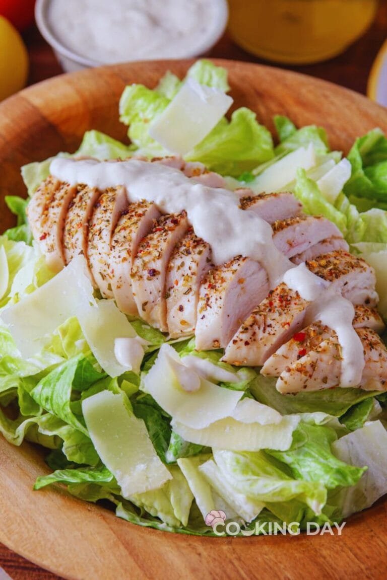 Chicken Caesar Salad with roasted chicken, romaine lettuce, Parmesan cheese, and creamy homemade Caesar dressing